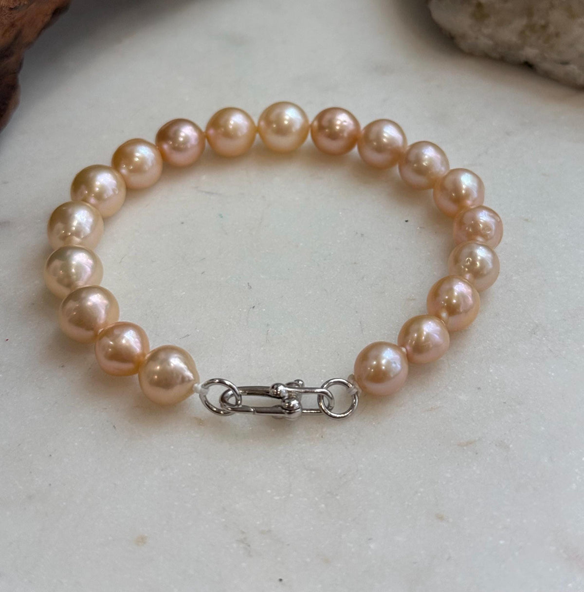 Warm peach golden pearls with reflective surfaces