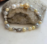 Genuine multicolor saltwater pearls arranged in a hand-knotted bracelet.