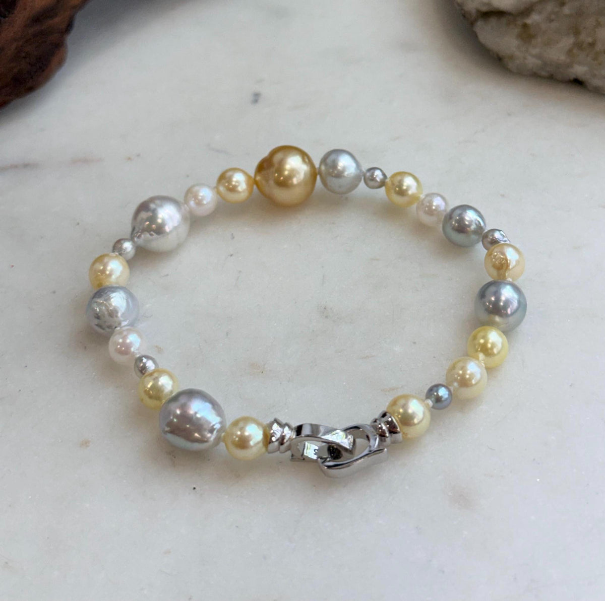 Multicolor ocean pearl bracelet finished with a sterling silver clasp.