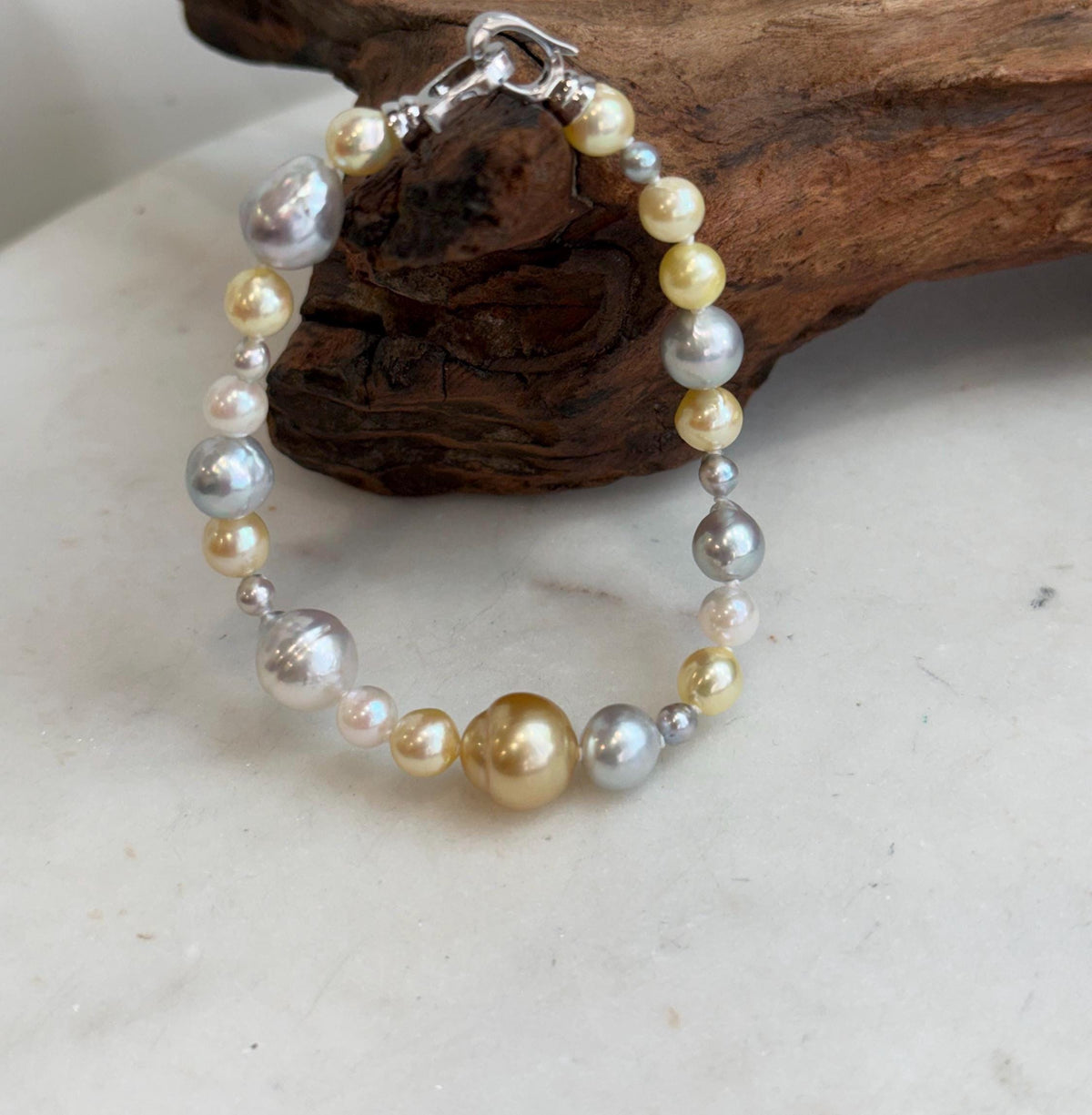 Ocean pearl jewelry featuring 24 saltwater pearls and a sterling silver clasp.