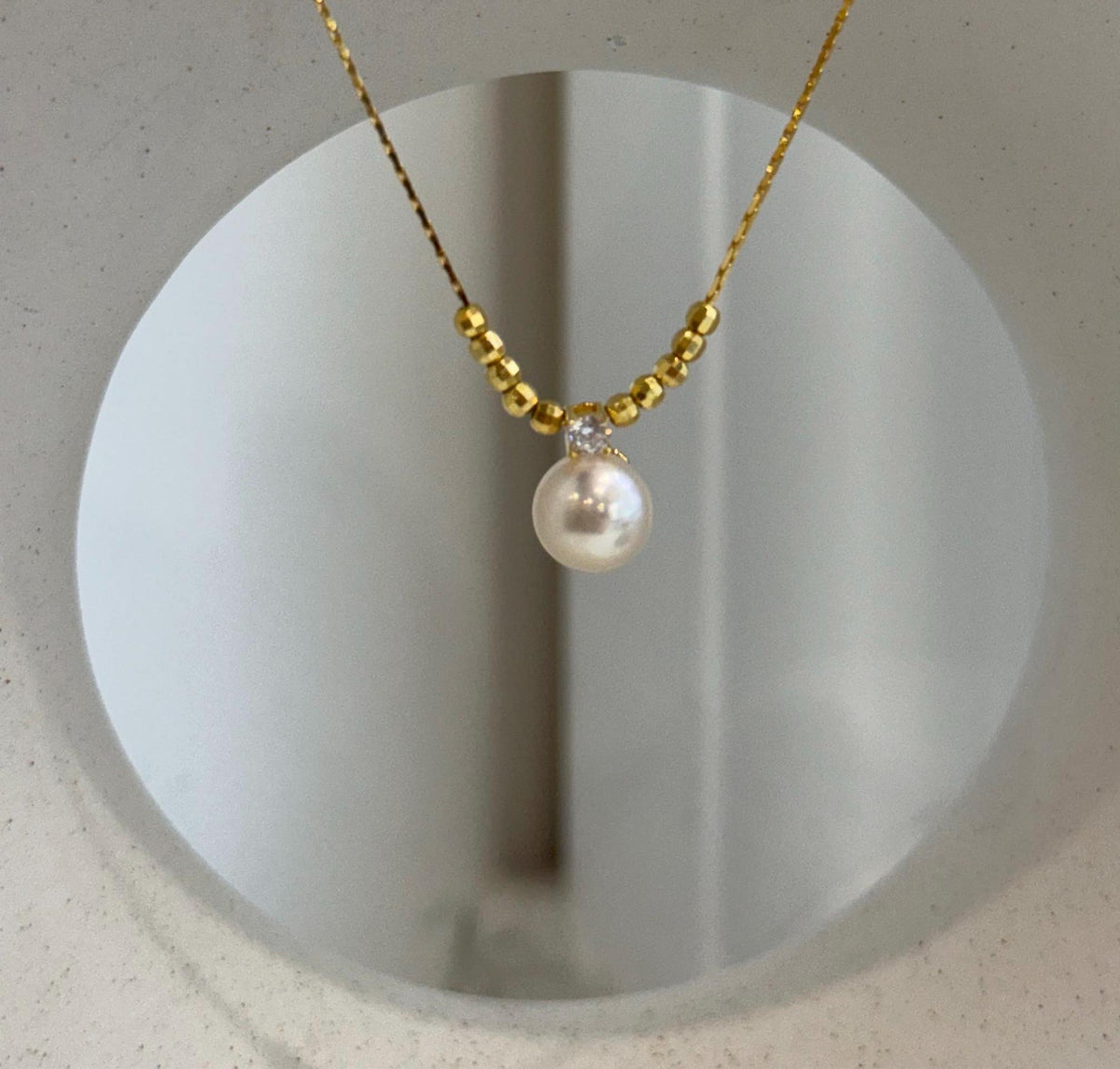Adjustable ivory Akoya pearl necklace crafted with S925 sterling silver.