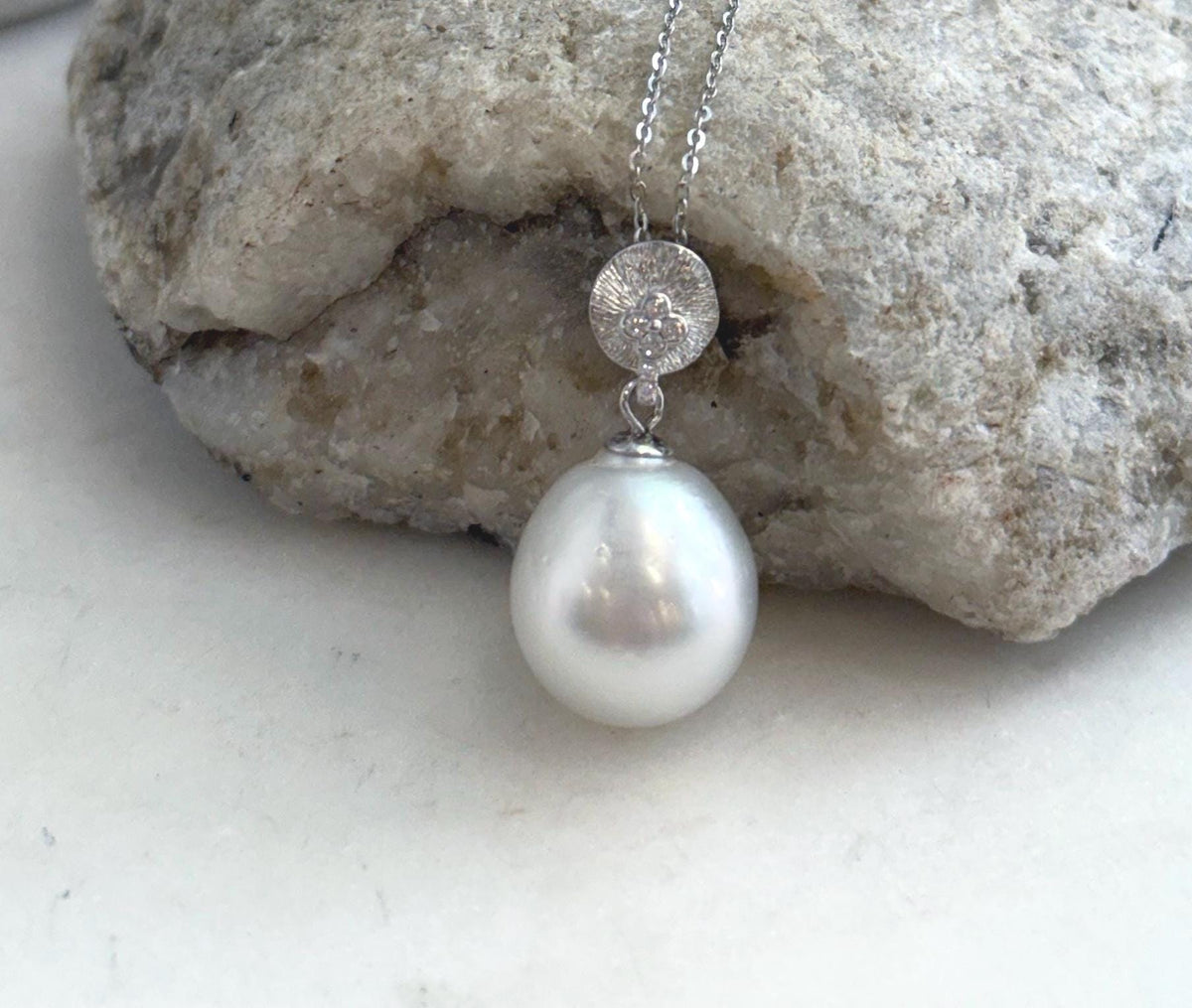 Sterling silver setting holding a luminous white South Sea pearl