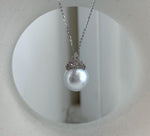 Close-up of the pearl pendant’s sparkling crown setting