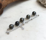 Two delicate silver chains combining lustrous Tahitian pearls and polished silver beads.