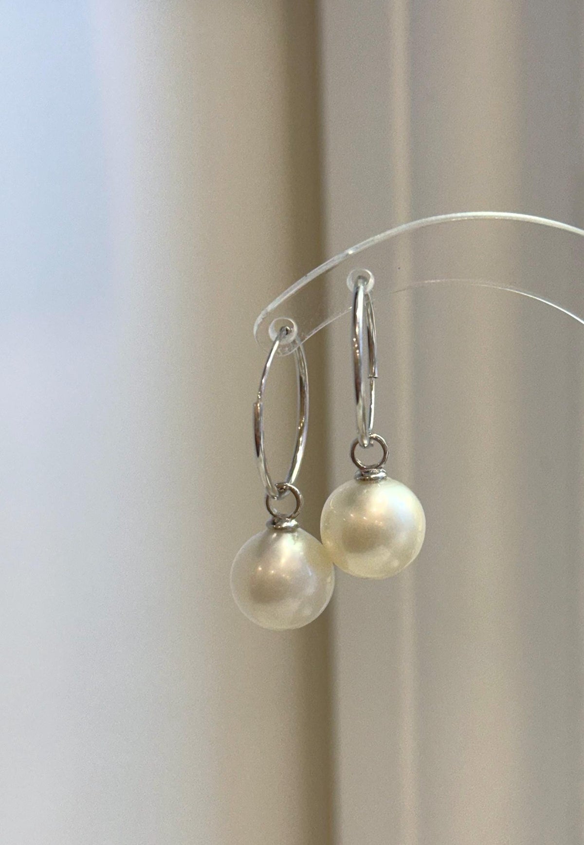 White South Sea pearl drops hanging from sterling silver hoop earrings