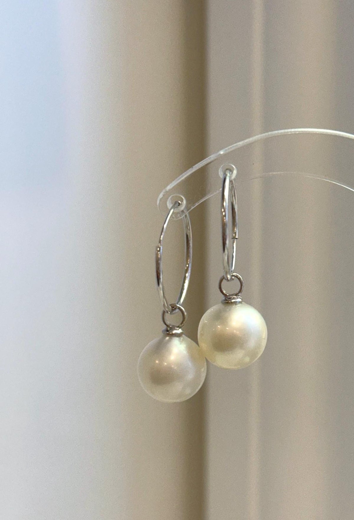 Sterling silver hoop earrings with removable white pearl charms