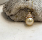 S925 sterling silver crown pendant with 18K gold plating and a genuine South Sea pearl.