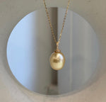 Golden iridescent South Sea pearl drop pendant with an S925 sterling silver setting.