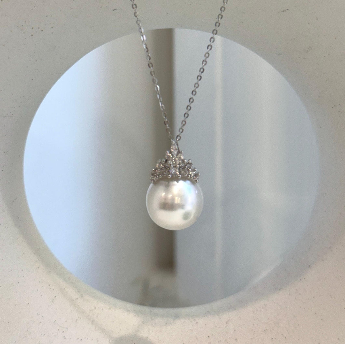 S925 sterling silver crown pendant featuring a lustrous Australian white pearl.