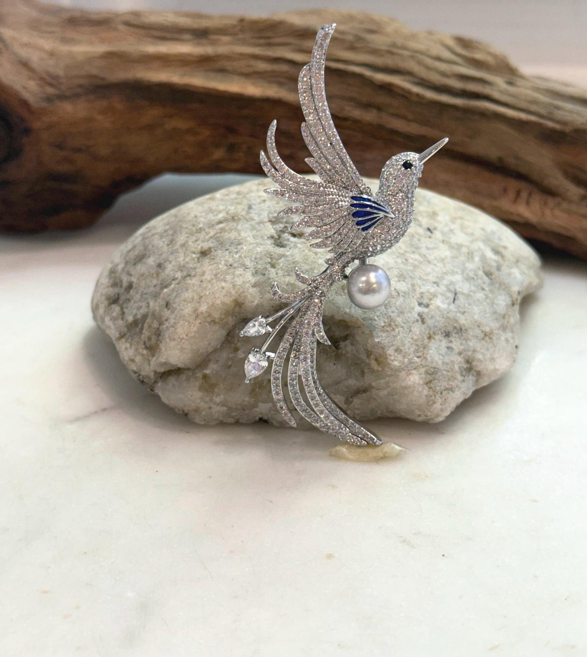 Genuine saltwater pearl brooch featuring a decorative bird design