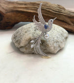 Genuine saltwater pearl brooch featuring a decorative bird design