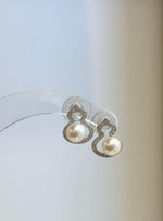 Pair of freshwater pearl studs featuring a delicate gourd design