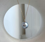 Silver blue South Sea pearl pendant with mirror luster, moissanite accents and an 18K solid gold setting.