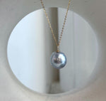 18K solid gold pendant featuring a lustrous silver blue South Sea pearl and sparkling moissanite.
