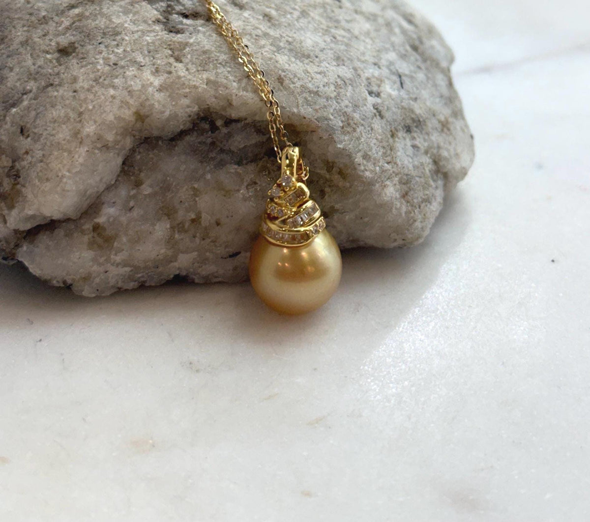 Genuine saltwater pearl pendant featuring a rich deep tea gold color.