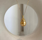 Golden South Sea pearl pendant displaying mirror-like luster.