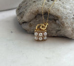 Akoya pearl pendant necklace featuring a miniature purse design