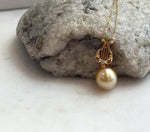 Genuine saltwater pearl pendant with deep tea gold coloring and mirror luster.