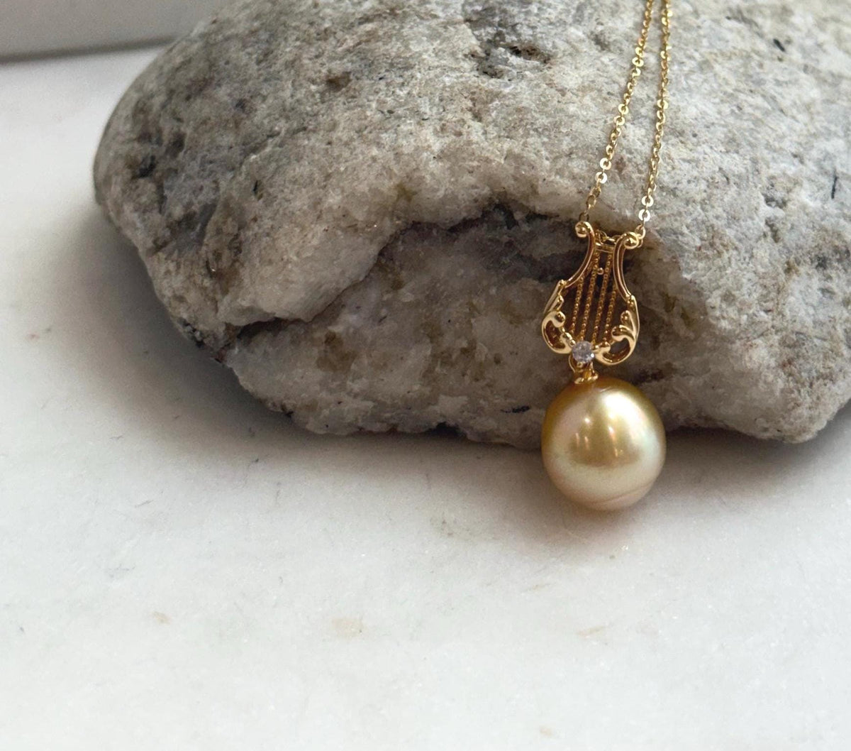 Genuine saltwater pearl pendant with deep tea gold coloring and mirror luster.