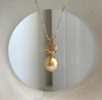 South Sea pearl Lyra pendant featuring a rich golden pearl and S925 sterling silver setting.