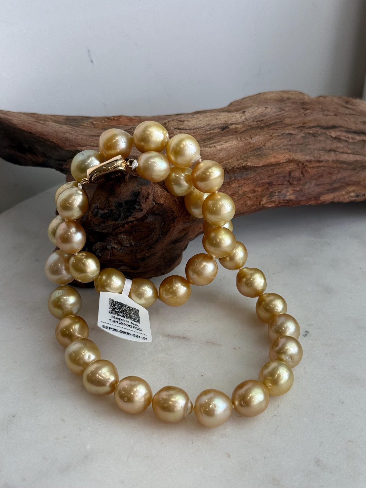 Classic strand necklace featuring 35 golden South Sea pearls