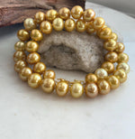 Hand-knotted strand of golden Edison pearls with bright mirror luster.