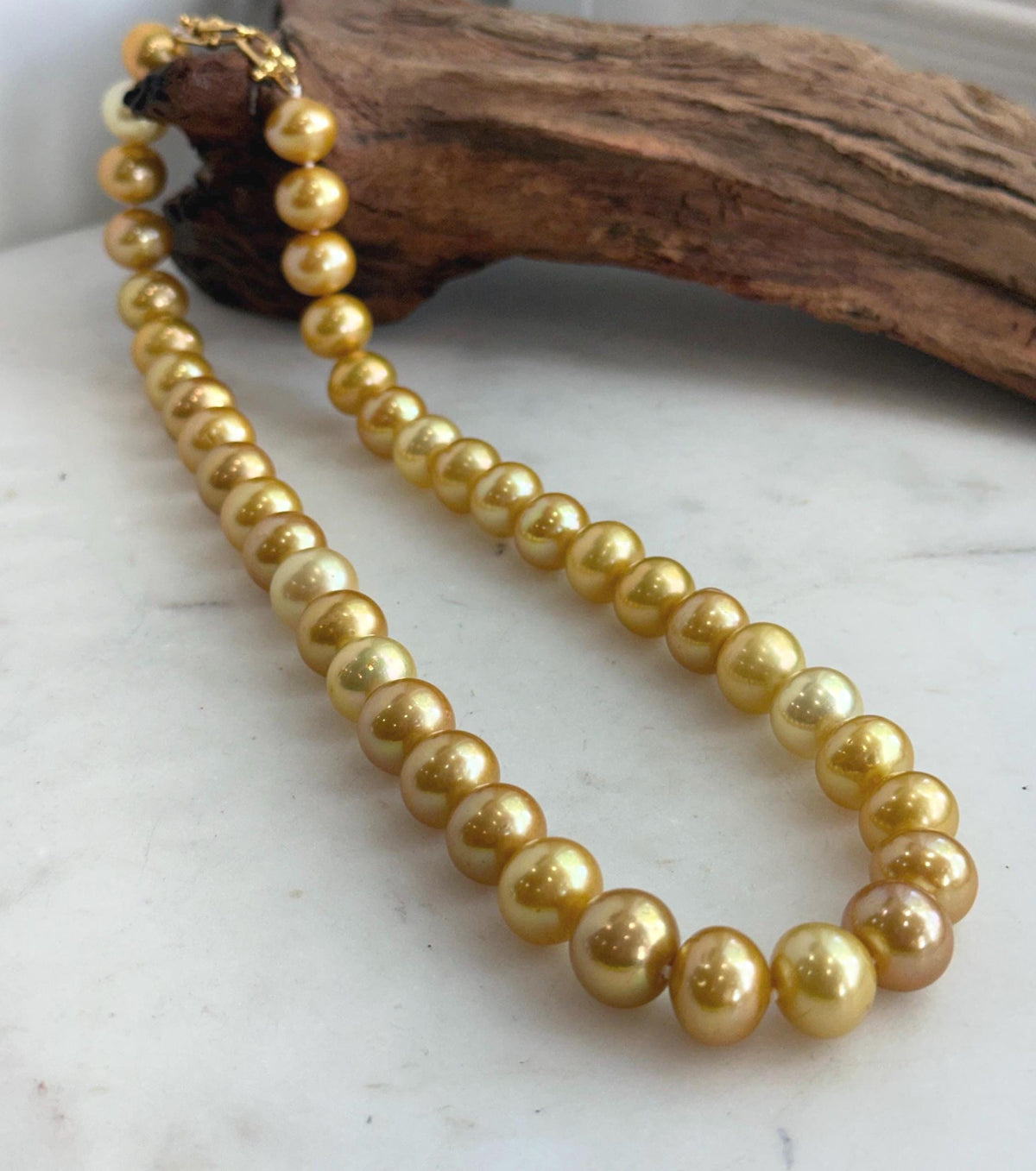 Classic single-strand necklace made with 41 golden Edison pearls.