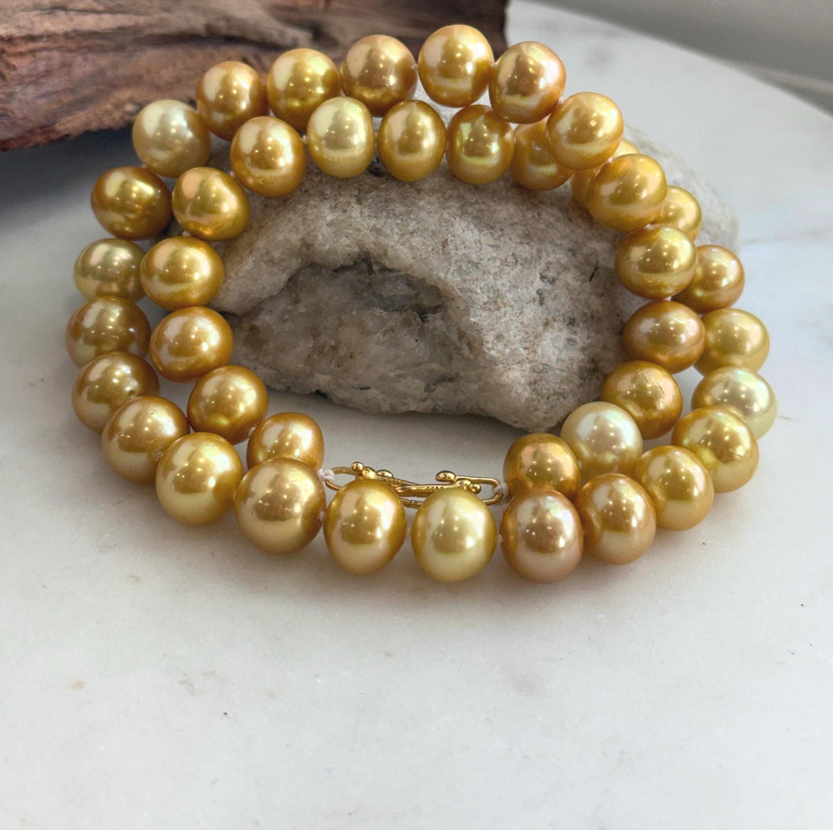 Hand-knotted golden pearl necklace with a knot between each freshwater pearl.
