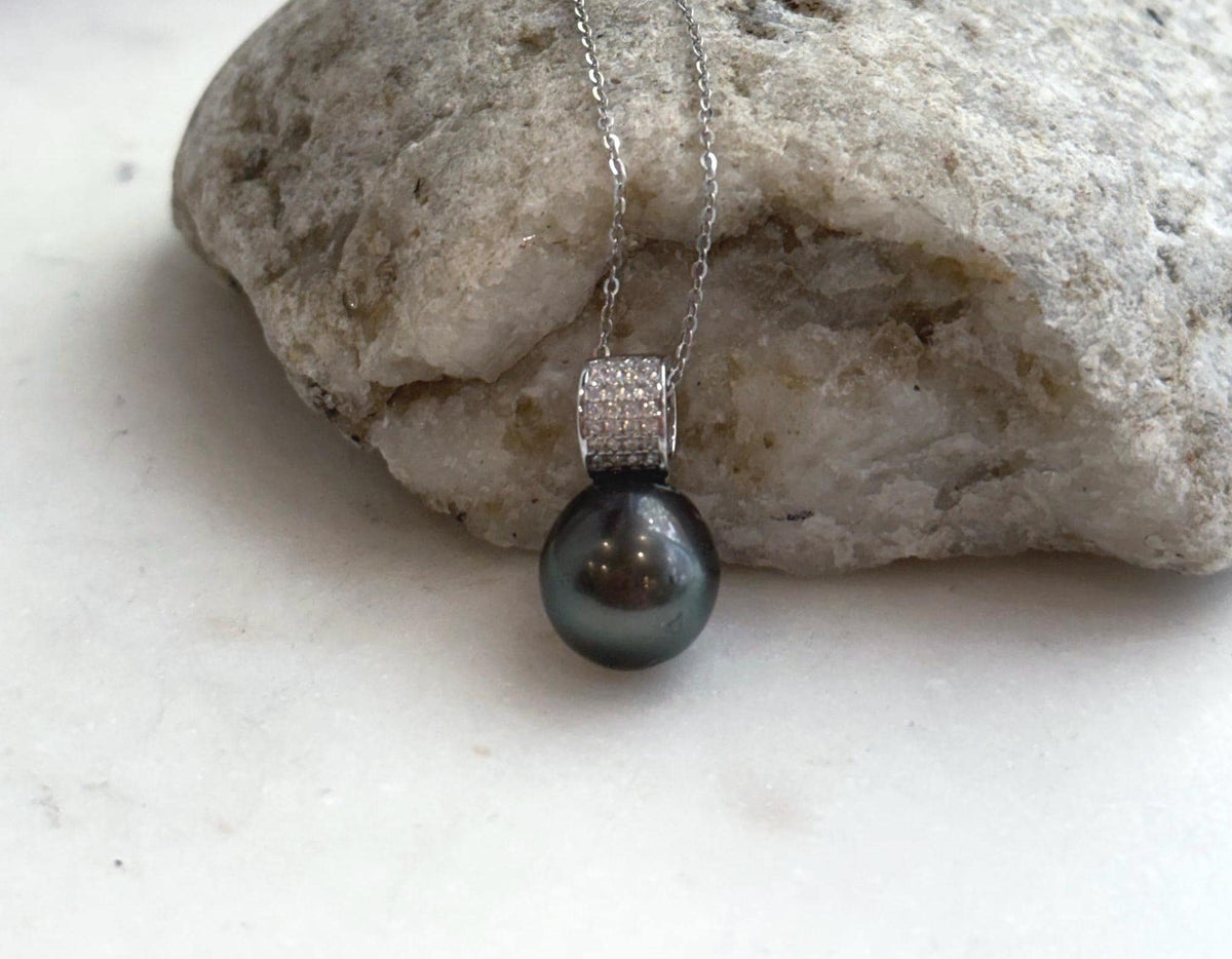 Hunter green saltwater pearl necklace with a crystal-decorated sterling silver pendant.