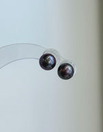 S925 sterling silver studs set with lustrous plum purple freshwater pearls.