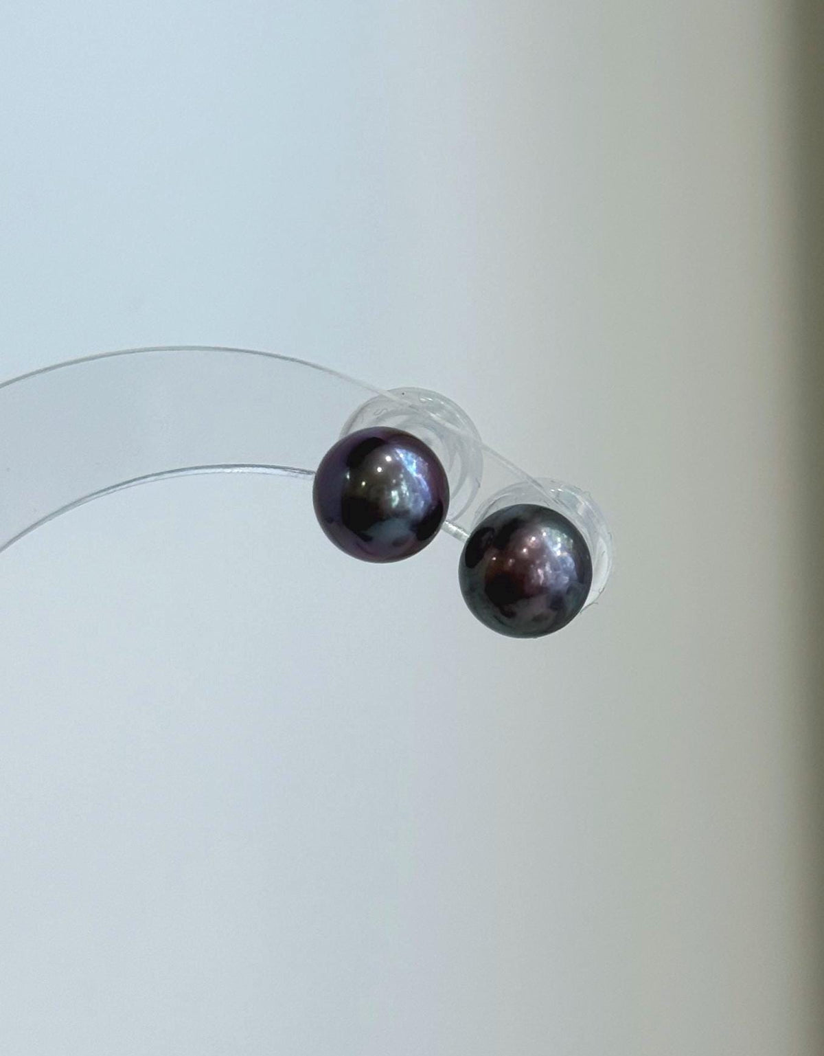 S925 sterling silver studs set with lustrous plum purple freshwater pearls.