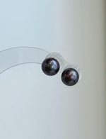 Mirror-luster plum pearls in a minimalist stud earring design.
