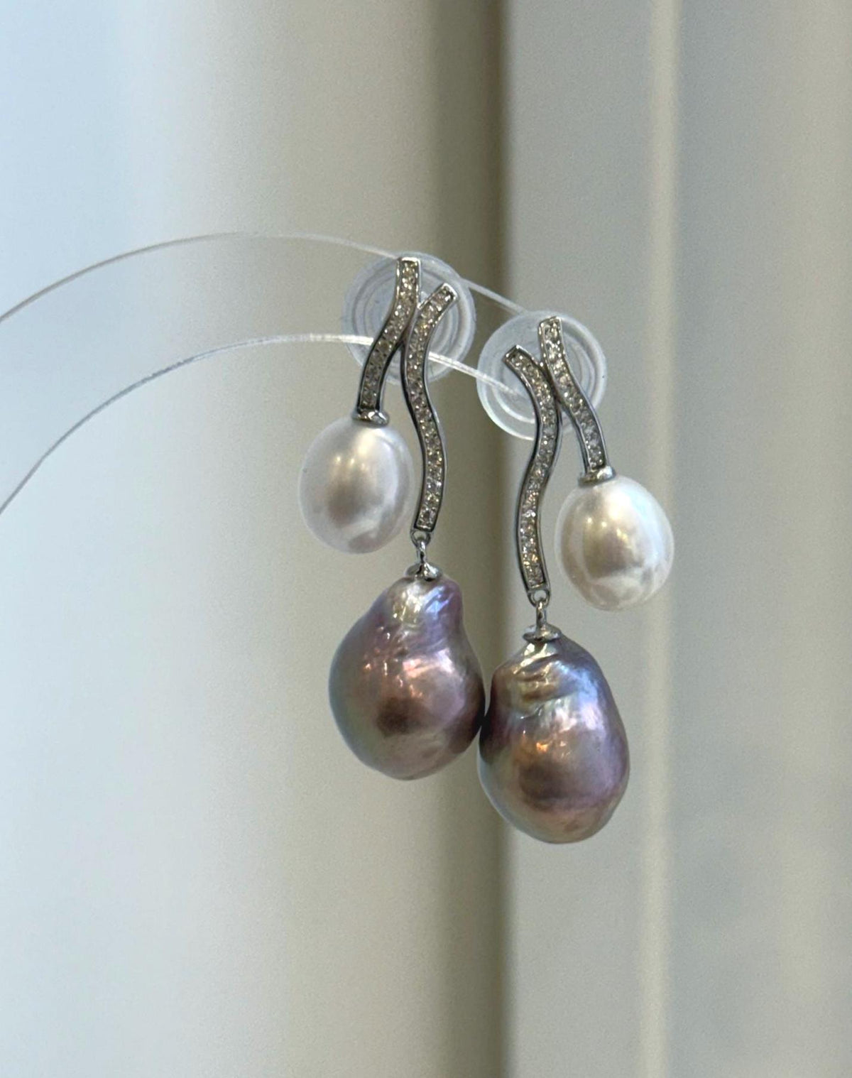 Baroque Keshi pearl earrings showing their unique organic shapes and crystal-accented design.