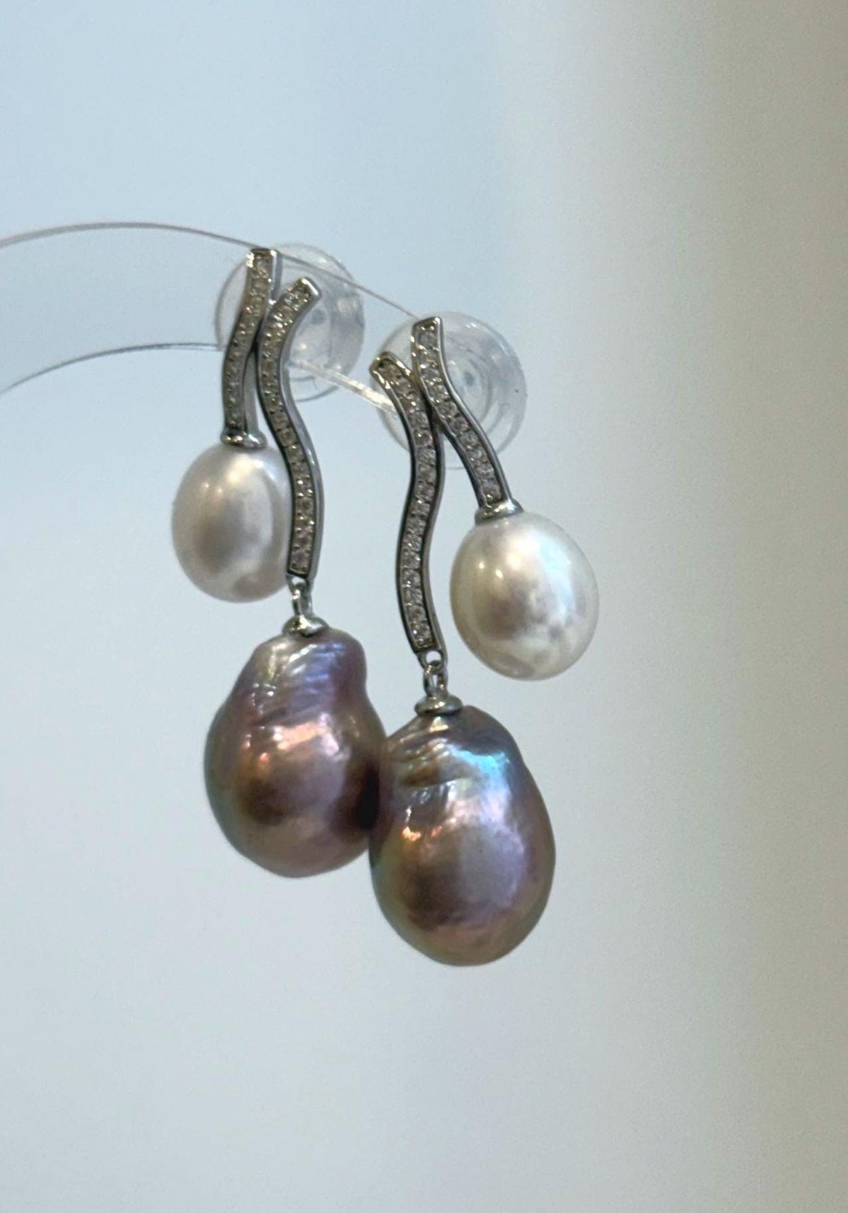 Rose purple Keshi pearls paired with white baroque pearls in a graceful drop design.