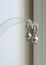 Elly’s silver blue Akoya pearl earrings with mirror luster and S925 sterling silver carabiner-style settings.