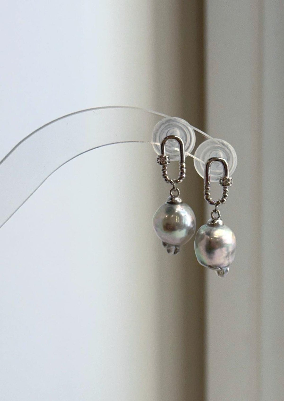 Elly’s silver blue Akoya pearl earrings with mirror luster and S925 sterling silver carabiner-style settings.