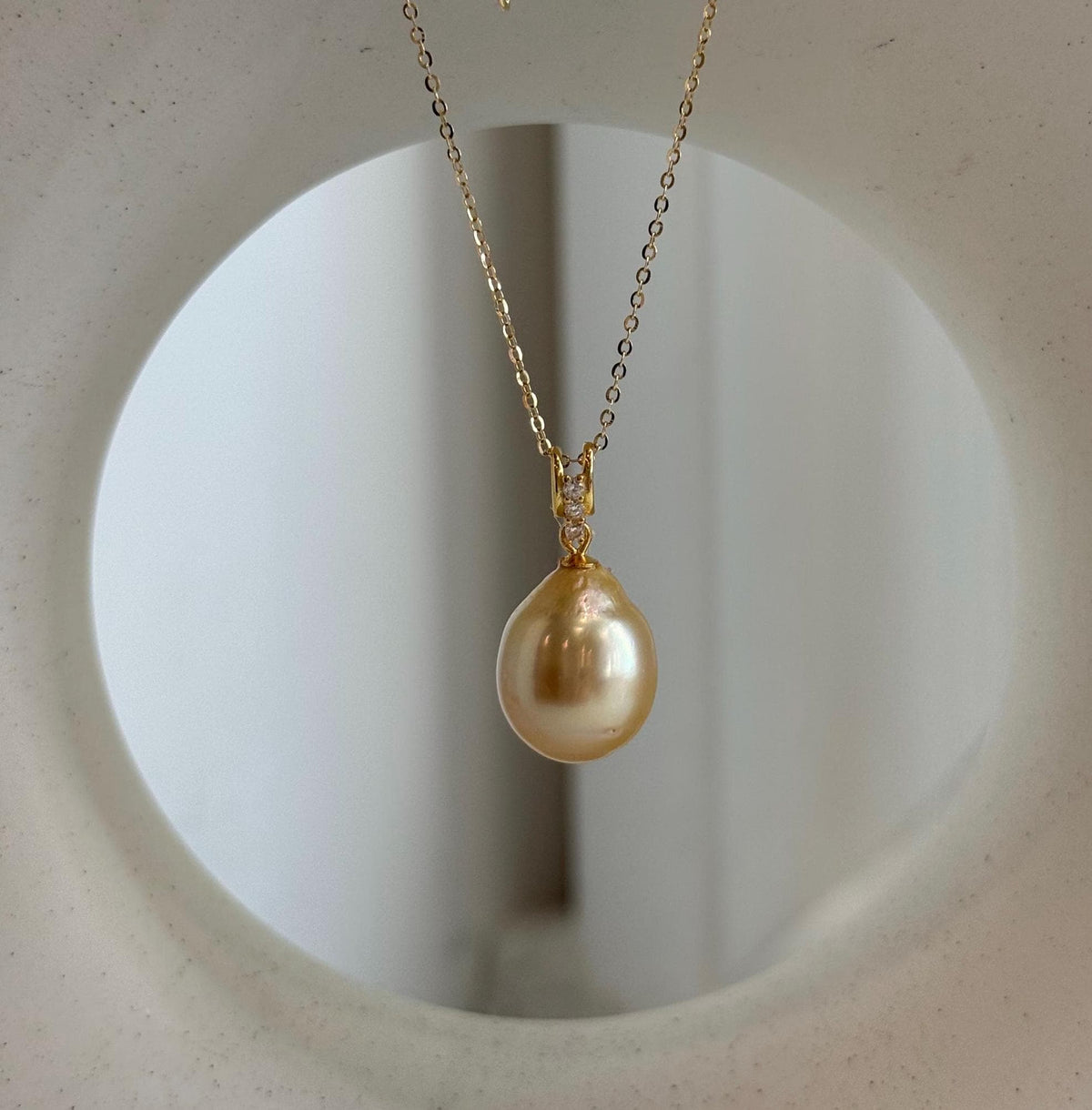 Deep tea gold South Sea pearl pendant with a sterling silver setting
