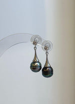 Genuine saltwater Tahitian pearls showing rich green tones in a modern earring design.