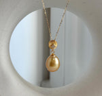 Golden South Sea pearl pendant with a highly reflective surface.