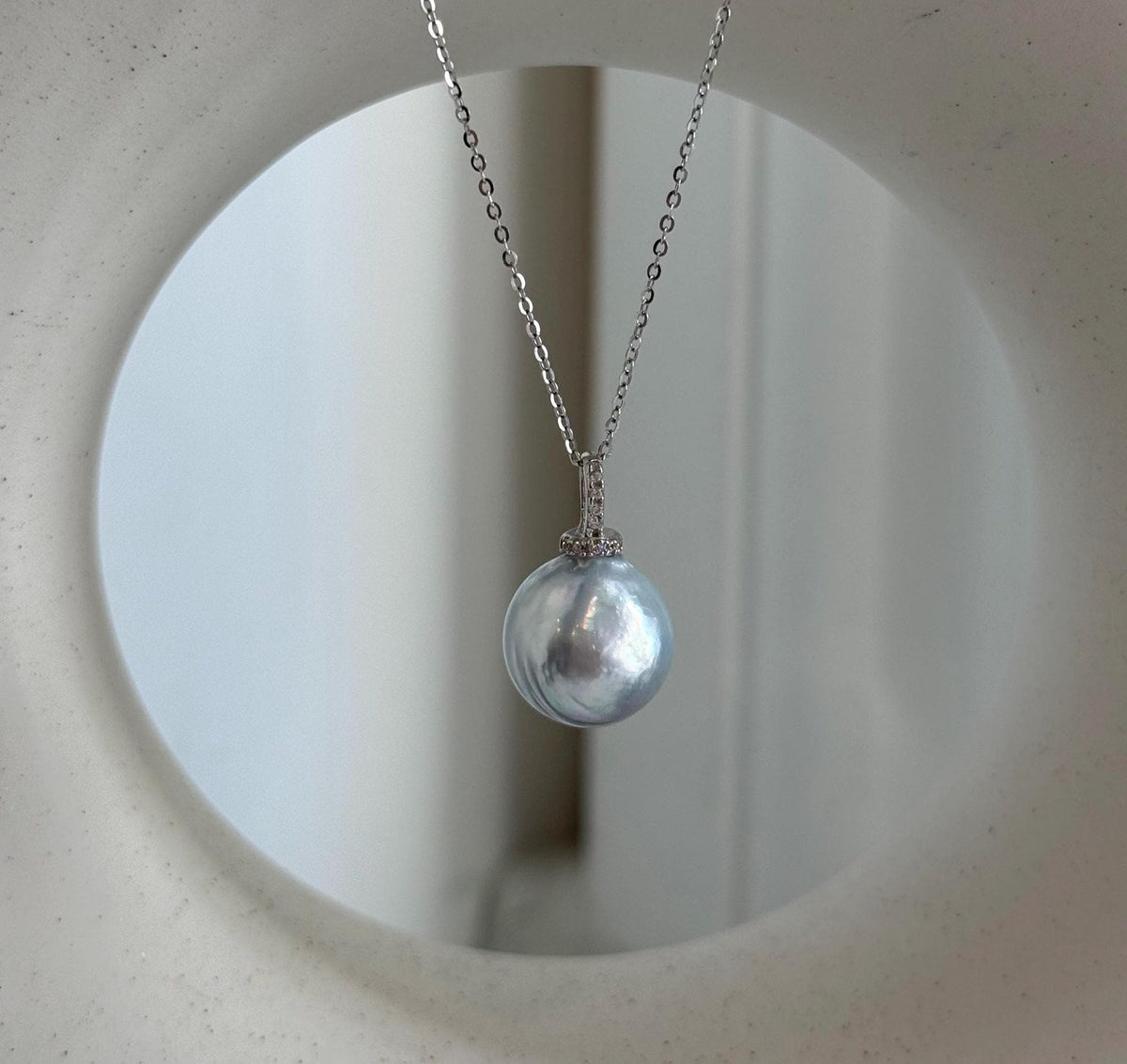 Australian silver blue South Sea pearl pendant with iridescent overtones and an S925 sterling silver setting.