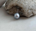 Genuine saltwater pearl pendant featuring a silver blue Australian South Sea pearl with extreme luster.