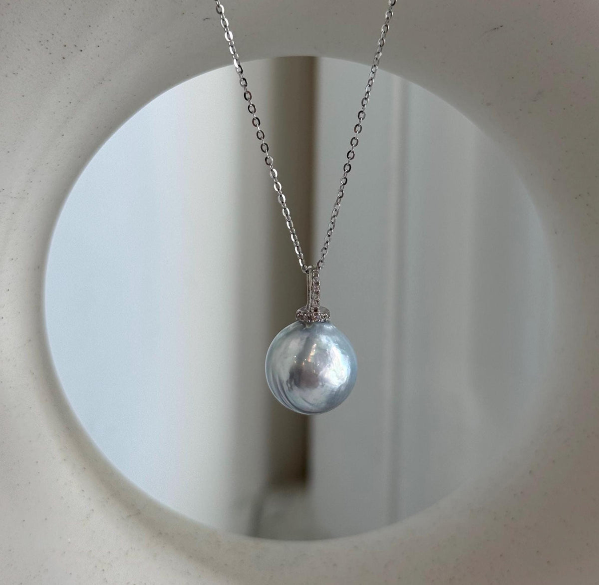 Silver blue iridescent pearl pendant made with a genuine Australian South Sea pearl.