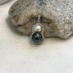 South Sea and Tahitian pearls arranged in a gourd shape with a sterling silver pendant setting.