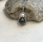 Two saltwater pearls stacked to form an elegant gourd-shaped pendant.