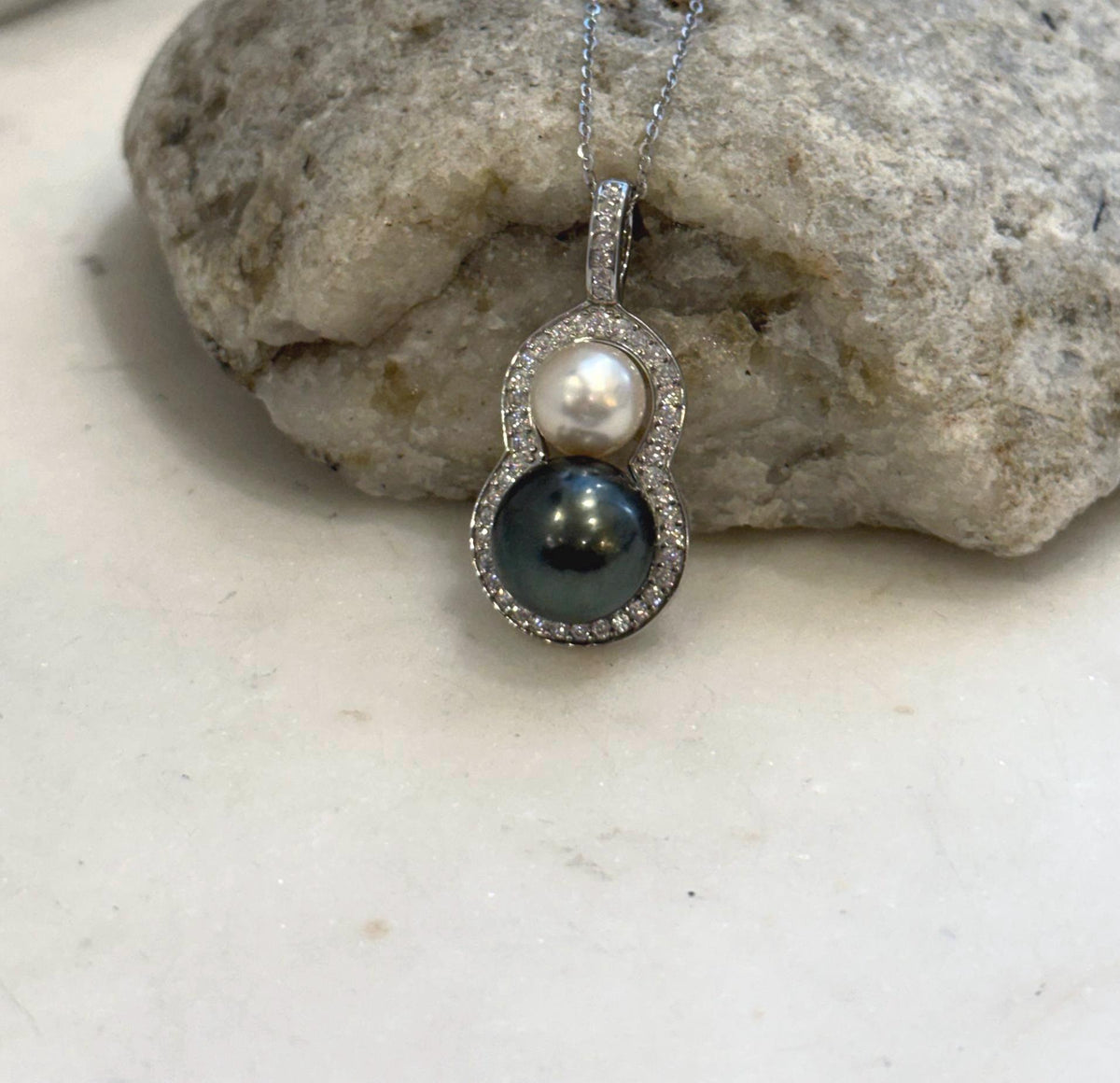Two saltwater pearls stacked to form an elegant gourd-shaped pendant.