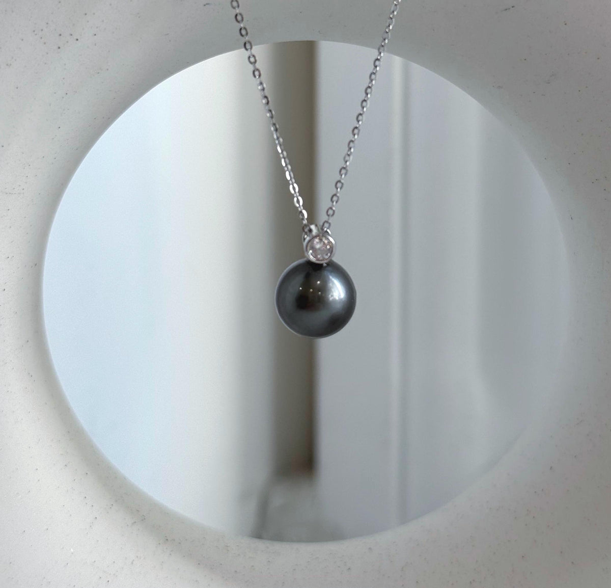 Platinum gray pearl pendant necklace in crystal-accented sterling silver.