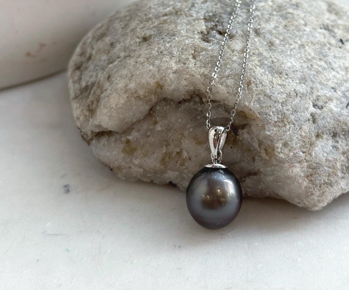 Mirror-luster Tahitian pearl necklace with a crystal-accented silver setting.