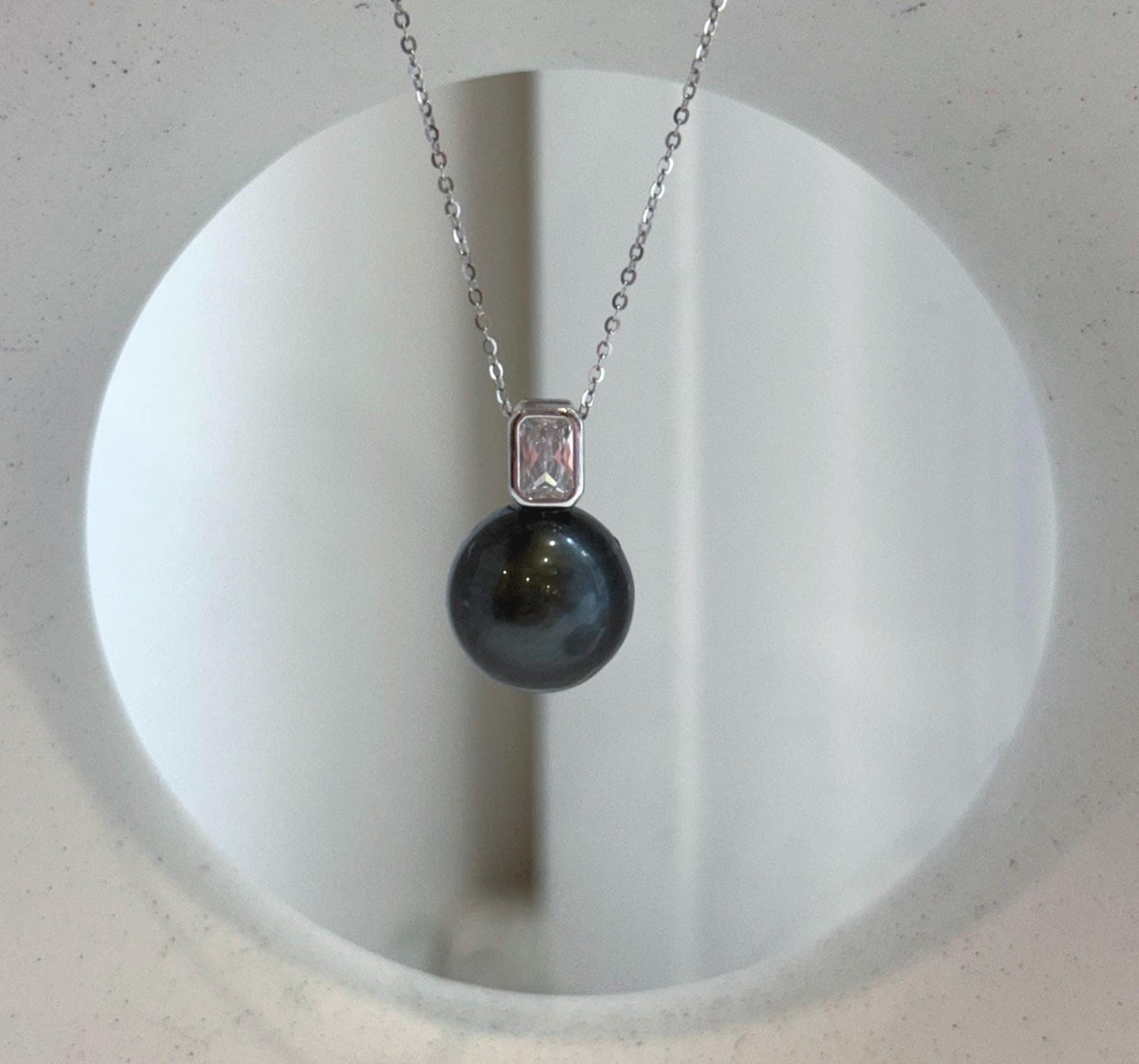 Piano black Tahitian pearl pendant necklace with a crystal-accented sterling silver setting