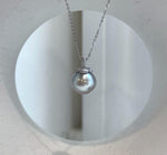 Front view of the silver taupe pearl persimmon pendant necklace.