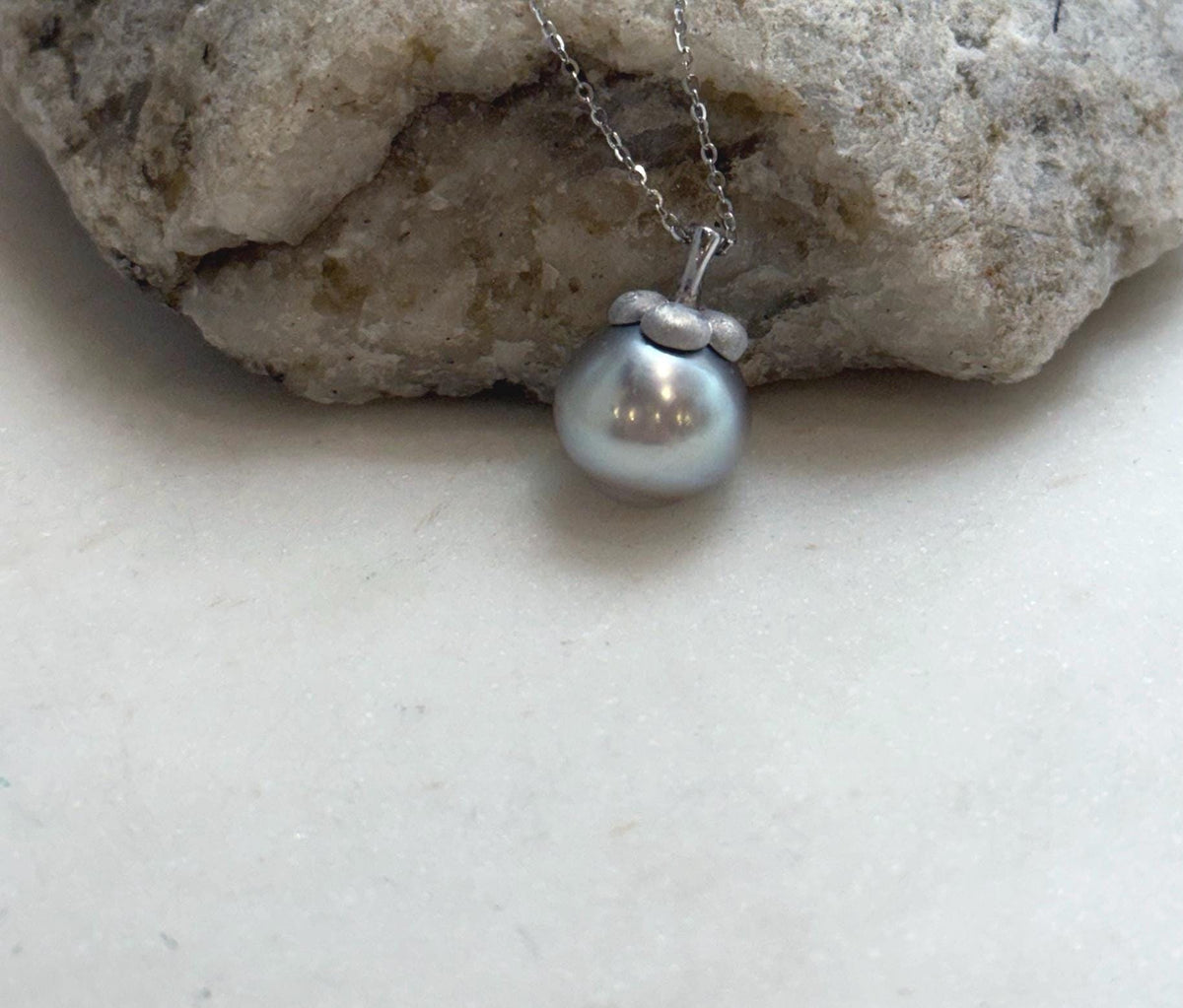 Silver taupe pearl with soft reflections and natural color variation.